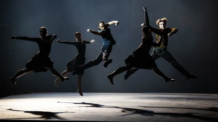 A group of people jumping in the air.