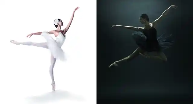 A ballerina in a white costume balances on one toe, the other leg is stretched back, opposite her a ballerina dressed in black makes a big jump.