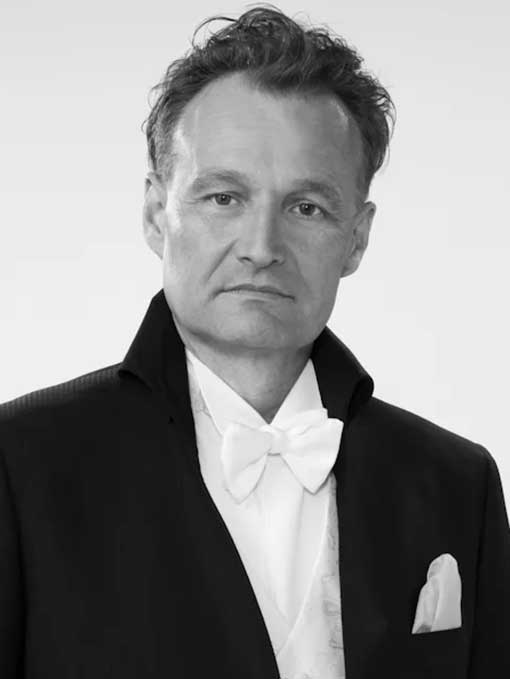 A close-up of a man wearing a tailcoat.