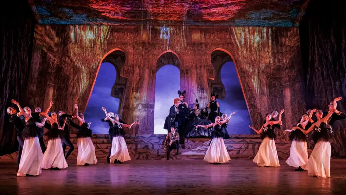 A group of people dancing on a stage.