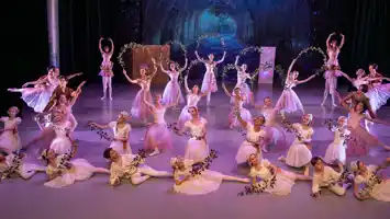 A scene with a variety of dancers in different positions and poses.